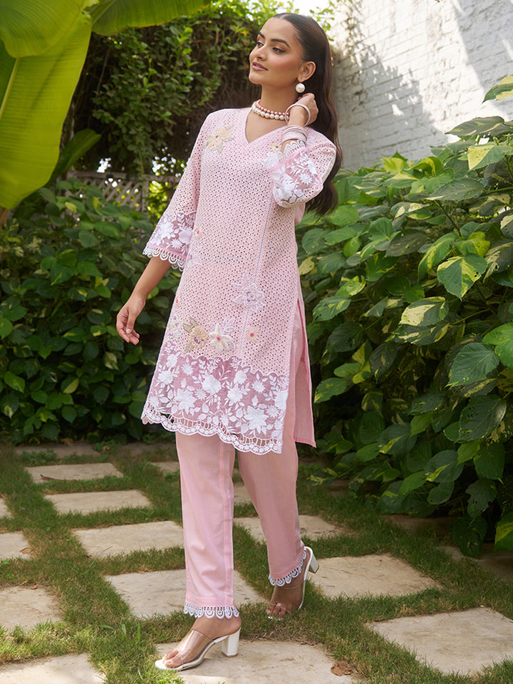 This V-neck co-ord set features delicate floral surface ornamentation for a graceful look. Shop Now!