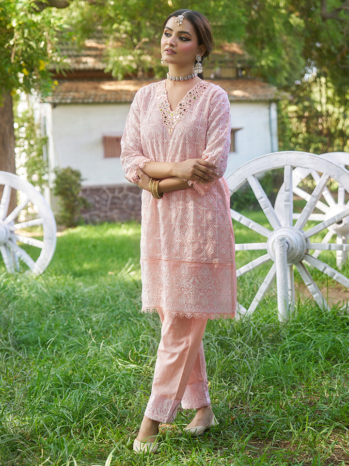 Designed in shimmer georgette, this co-ord set features intricate schiffli embroidery. Shop Now!