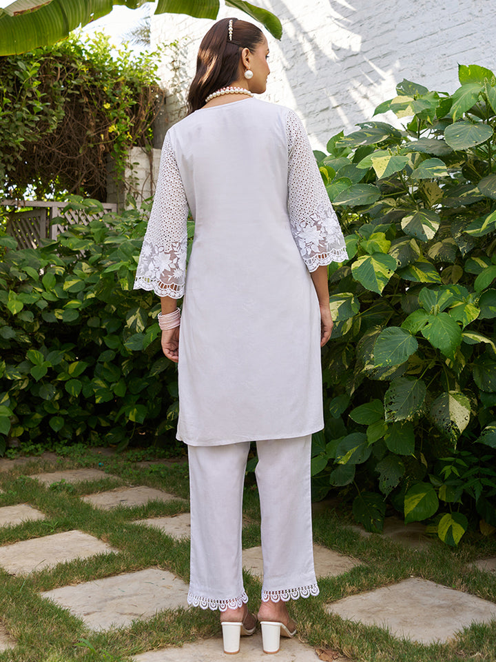 This V-neck co-ord set features delicate floral surface ornamentation for a graceful look. Shop Now!