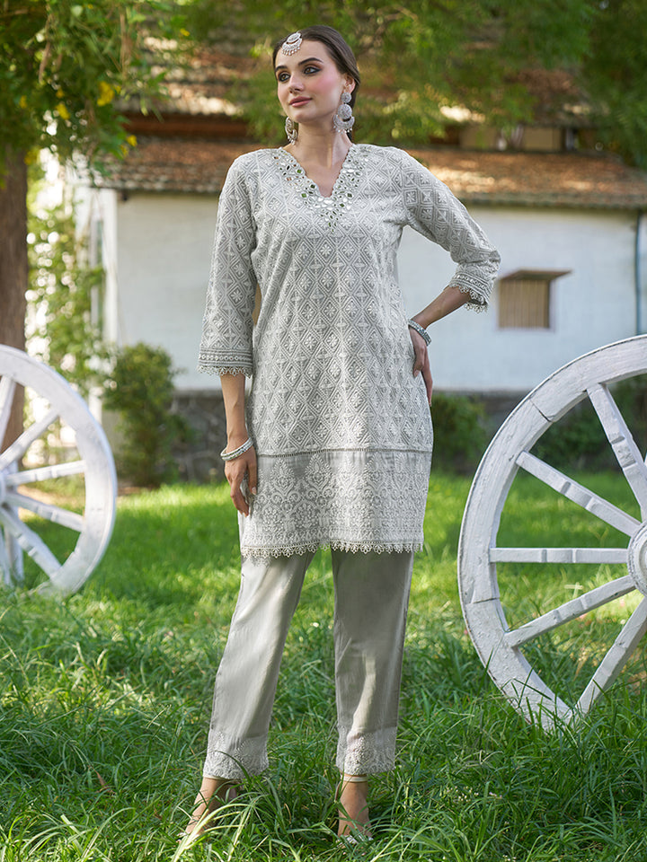 Designed in shimmer georgette, this co-ord set features intricate schiffli embroidery. Shop Now!