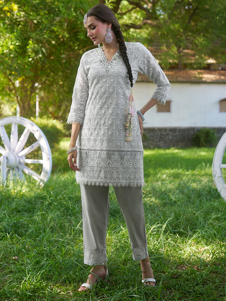 Designed in shimmer georgette, this co-ord set features intricate schiffli embroidery. Shop Now!