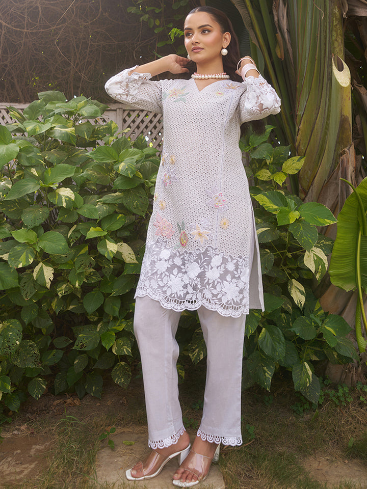 This V-neck co-ord set features delicate floral surface ornamentation for a graceful look. Shop Now!
