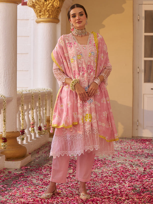 This elegant cotton Anarkali kurta set showcases delicate floral embroidery. Shop Now!
