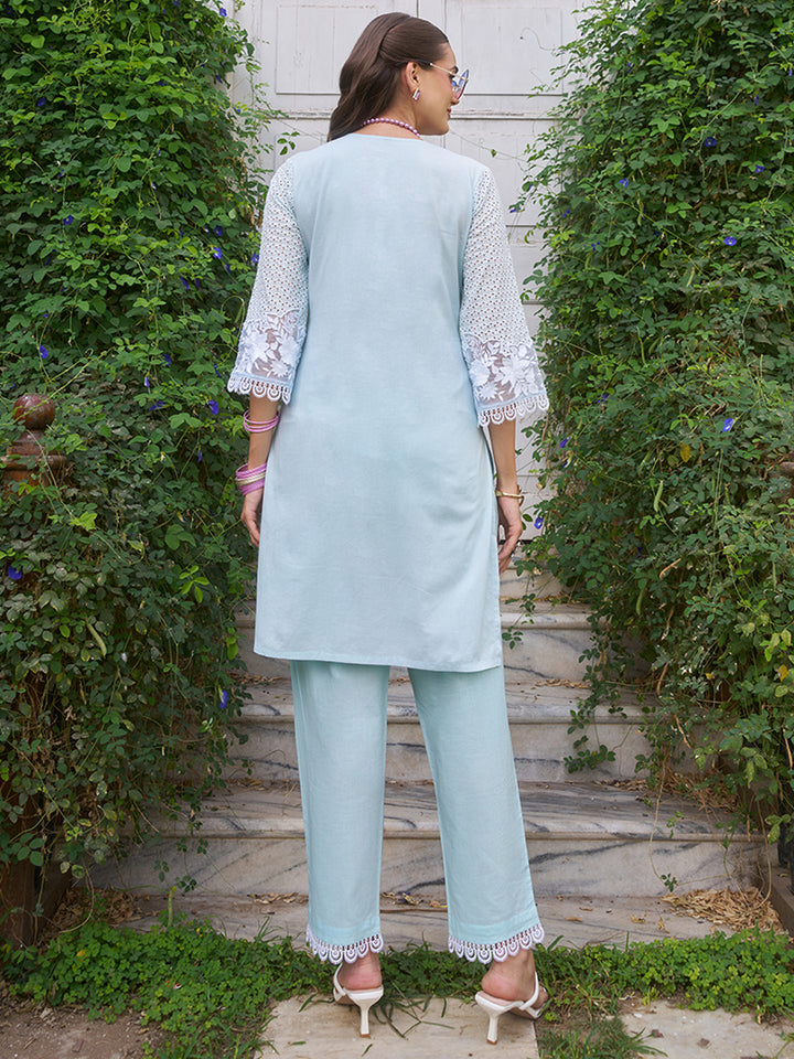 This V-neck co-ord set features delicate floral surface ornamentation for a graceful look. Shop Now!