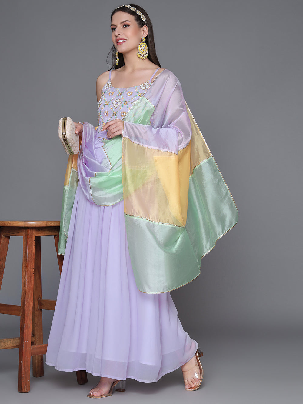 Featuring a violet ethnic dress with intricate handwork embroidery with organza dupatta. Shop Now!